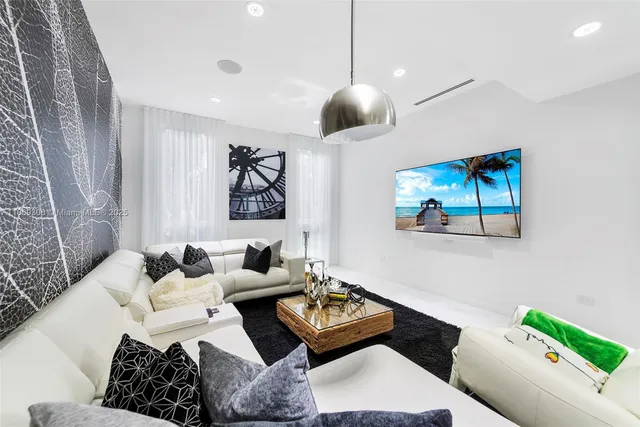 a living room with furniture fireplace and couch