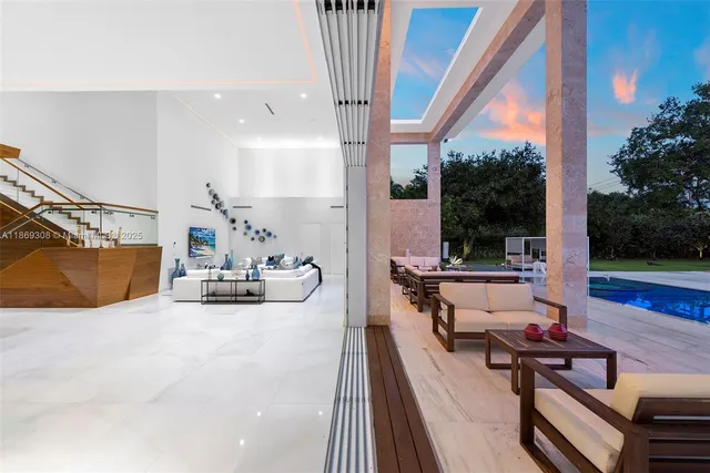 a living room with lots of furniture and gym equipment