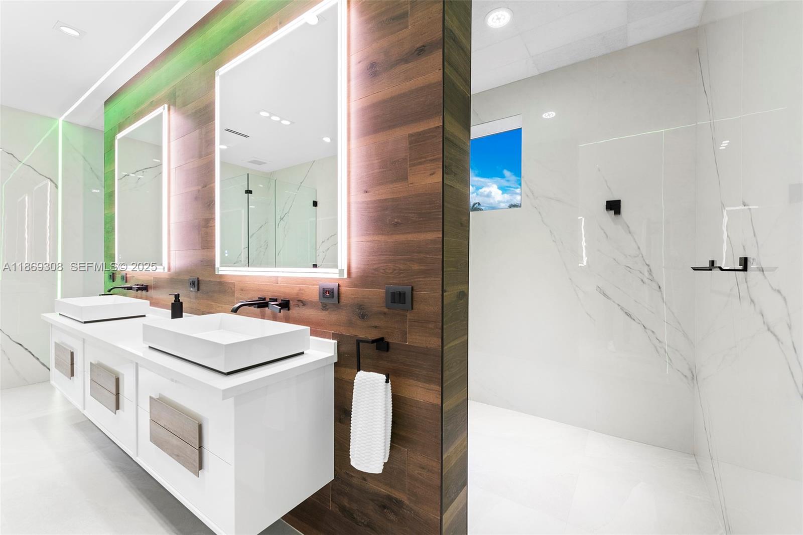 7450 Southwest 102nd Street Pinecrest, FL 33156 - Photo 29 of 51 a bathroom with a sink a vanity and a mirror