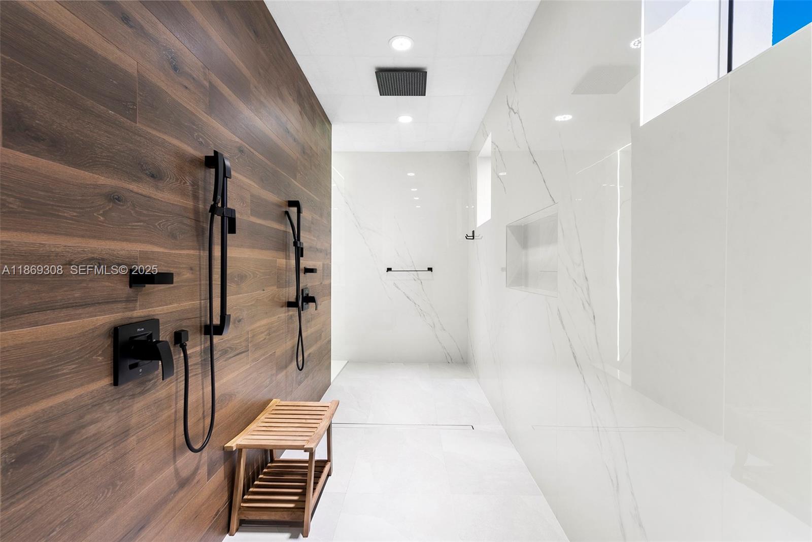 7450 Southwest 102nd Street Pinecrest, FL 33156 - Photo 30 of 51 a bathroom with a shower and a glass door