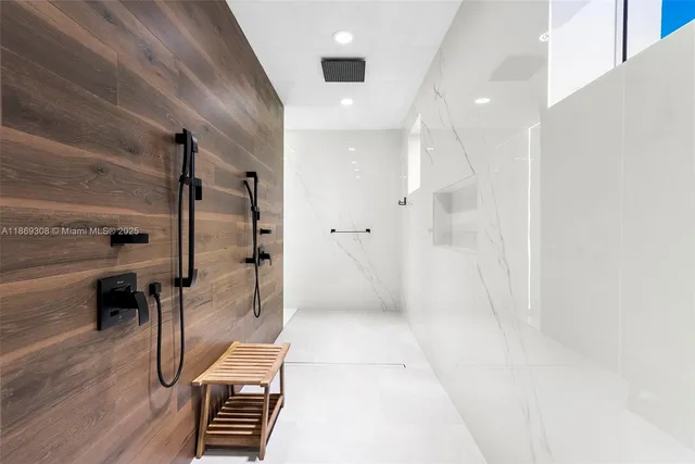 a bedroom with a large bed and a couch