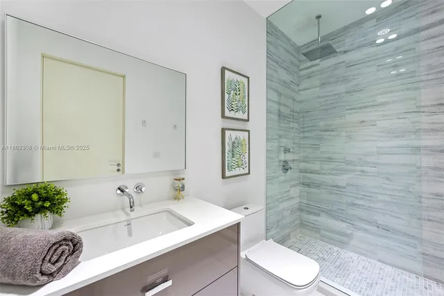 a bedroom with a bed and walk in closet