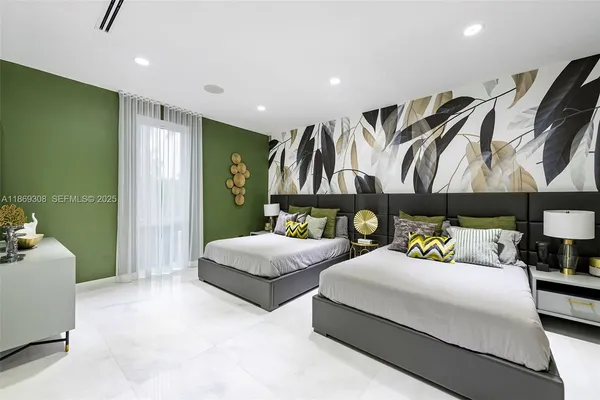 a bedroom with a bed and dresser