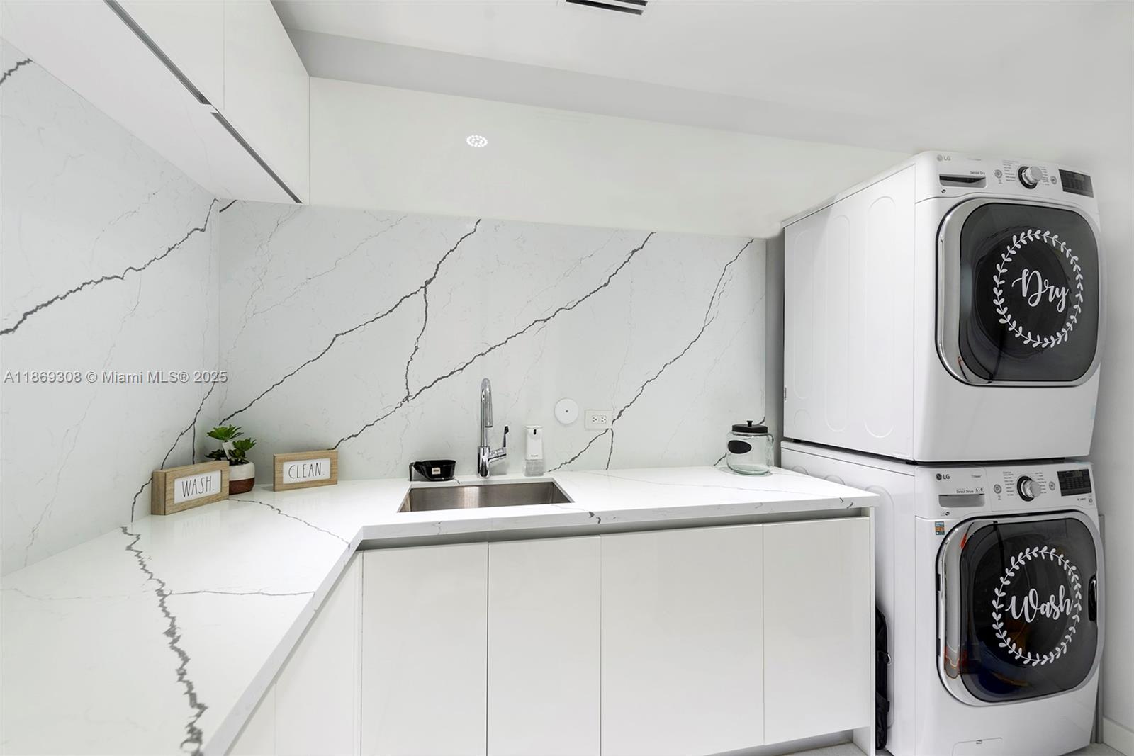 7450 Southwest 102nd Street Pinecrest, FL 33156 - Photo 43 of 51 a utility room with dryer and washer