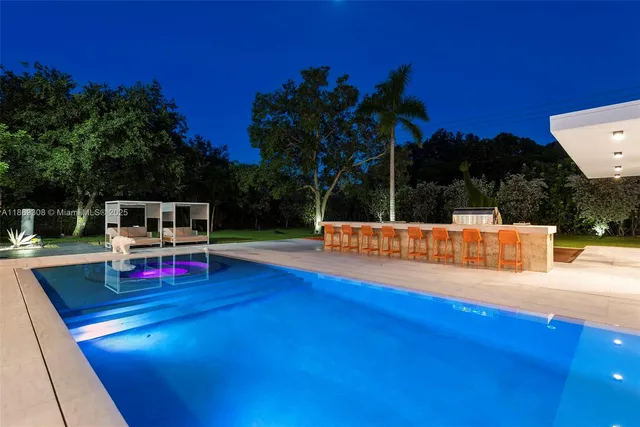 a kitchen with lots of counter top space and dining table