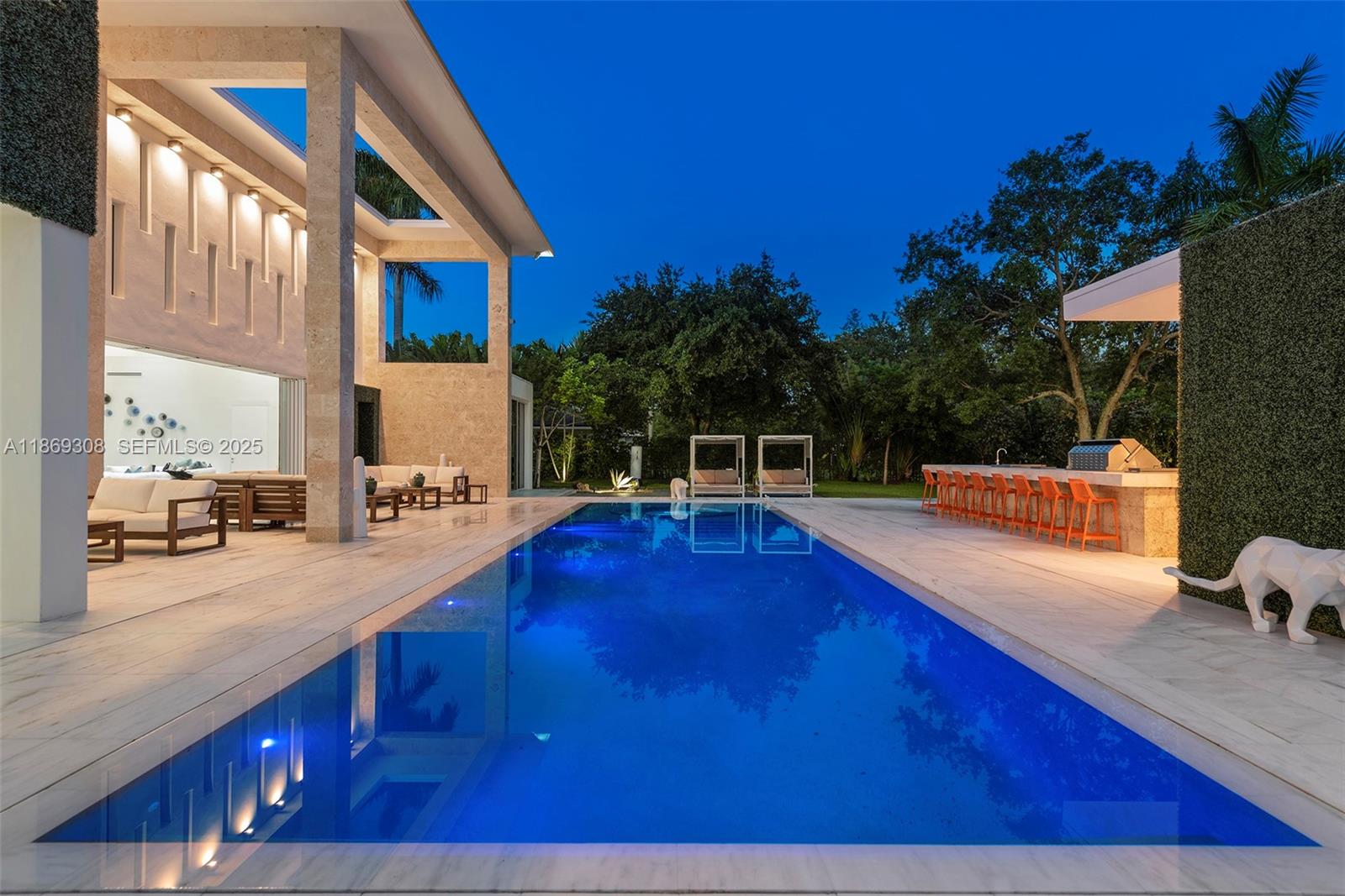 7450 Southwest 102nd Street Pinecrest, FL 33156 - Photo 48 of 51 a view of a house with swimming pool