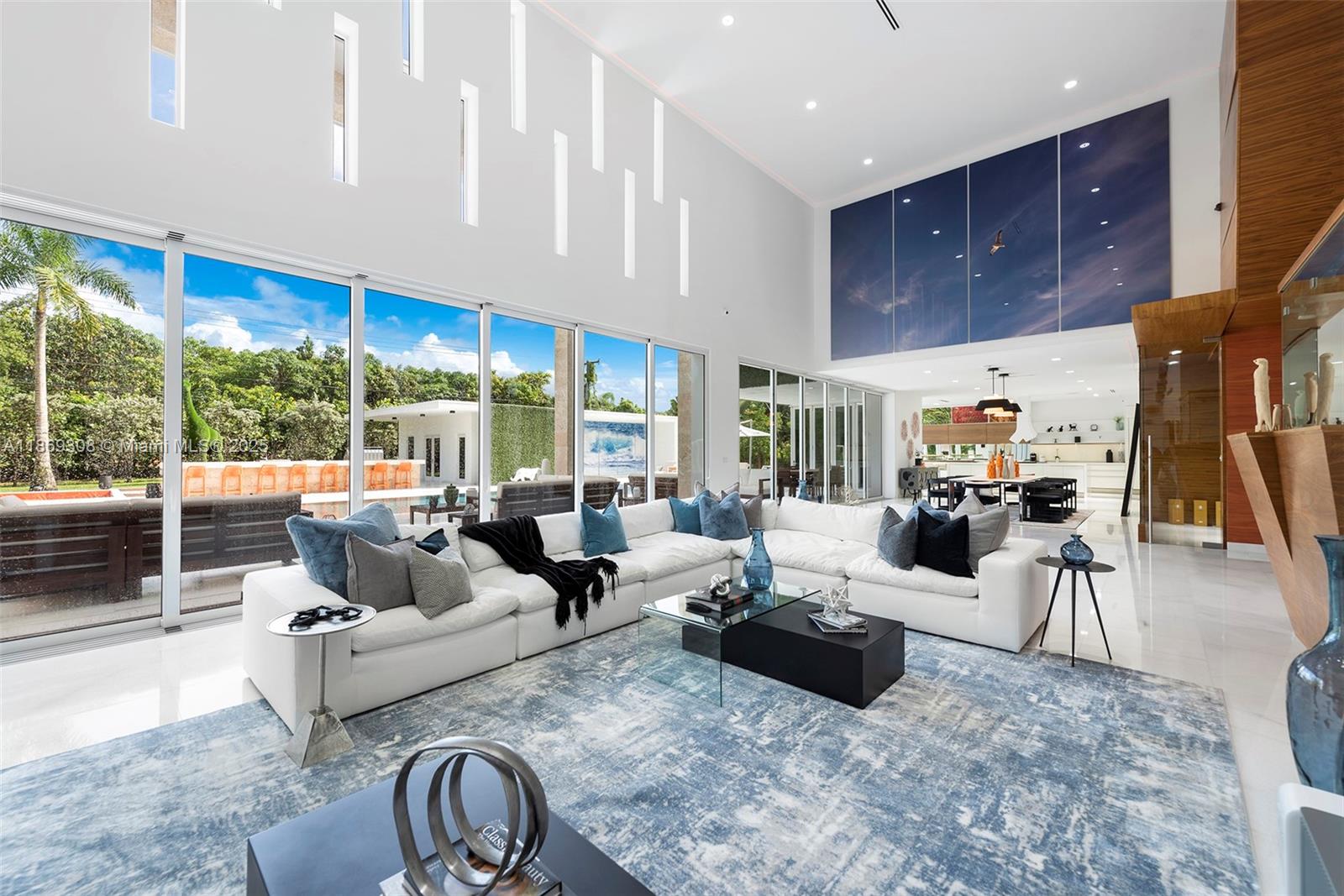 7450 Southwest 102nd Street Pinecrest, FL 33156 - Photo 7 of 51 a living room with furniture and a large window