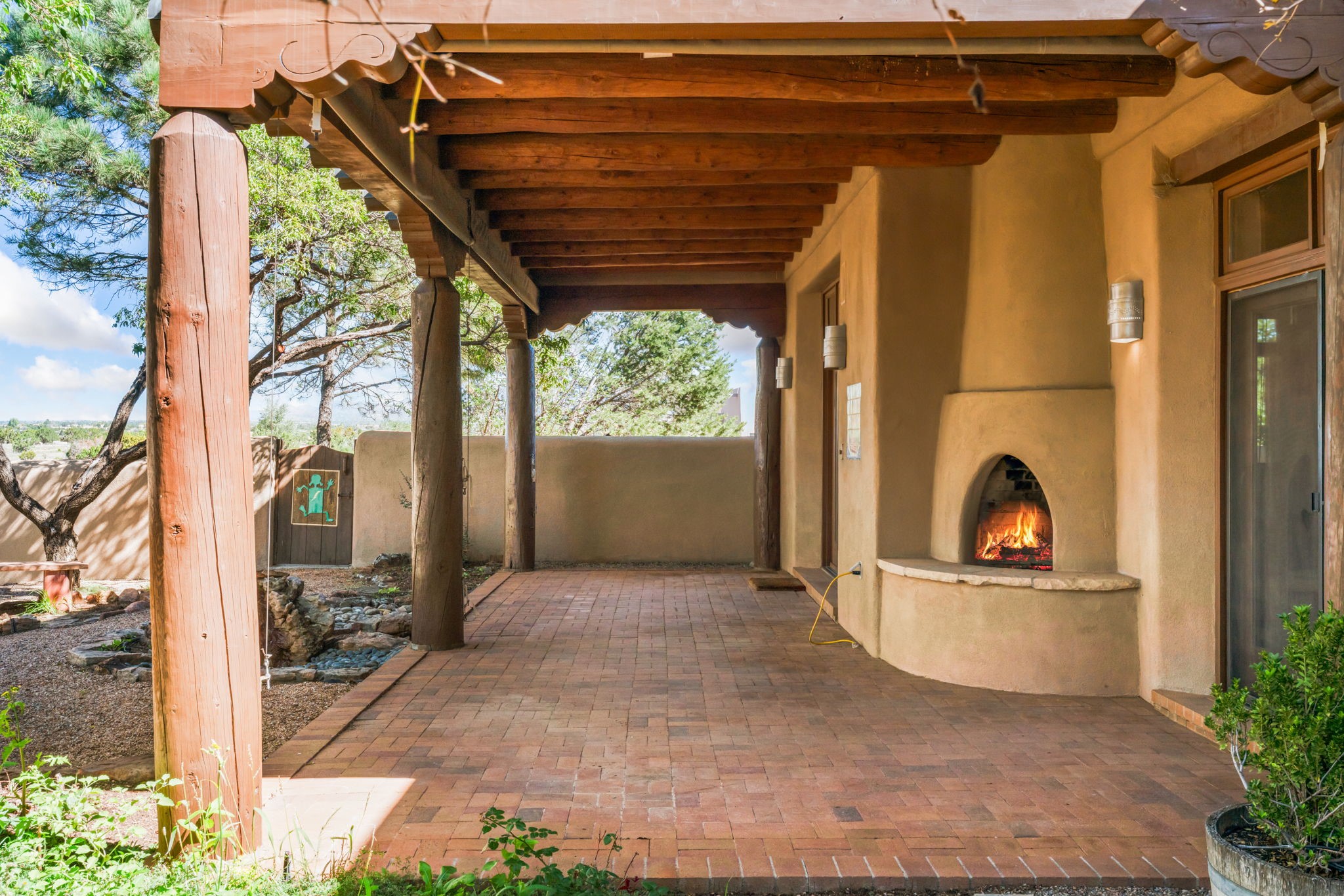 10 Antigua Road Santa Fe, NM 87508 - Photo 42 of 57 Kiva fireplace on rear portal.