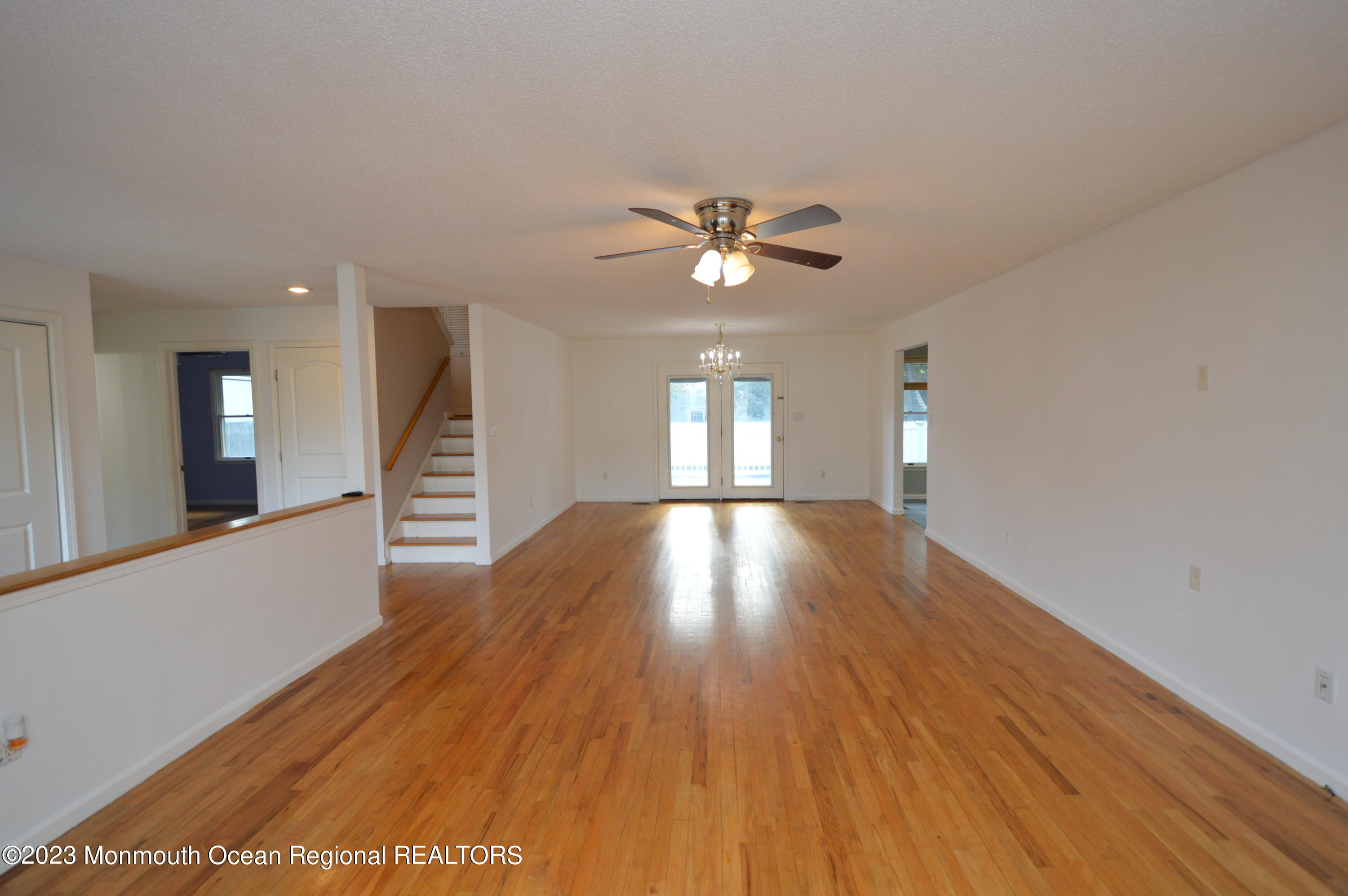 271 Sextant Road Manahawkin, NJ 08050 - Photo 13 of 48 a view of empty room with wooden floor and fan