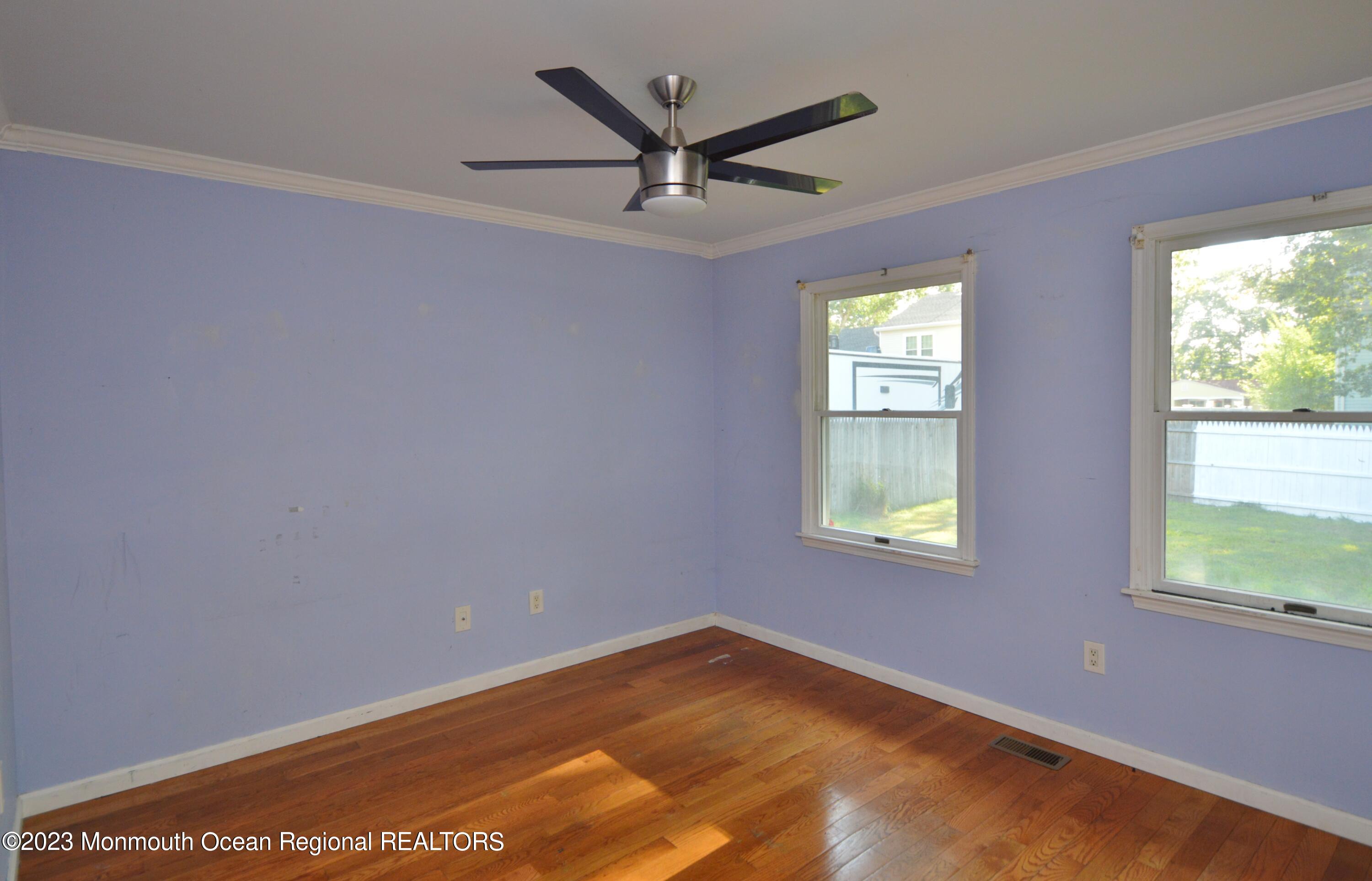 271 Sextant Road Manahawkin, NJ 08050 - Photo 26 of 48 a view of empty room with ceiling fan and window