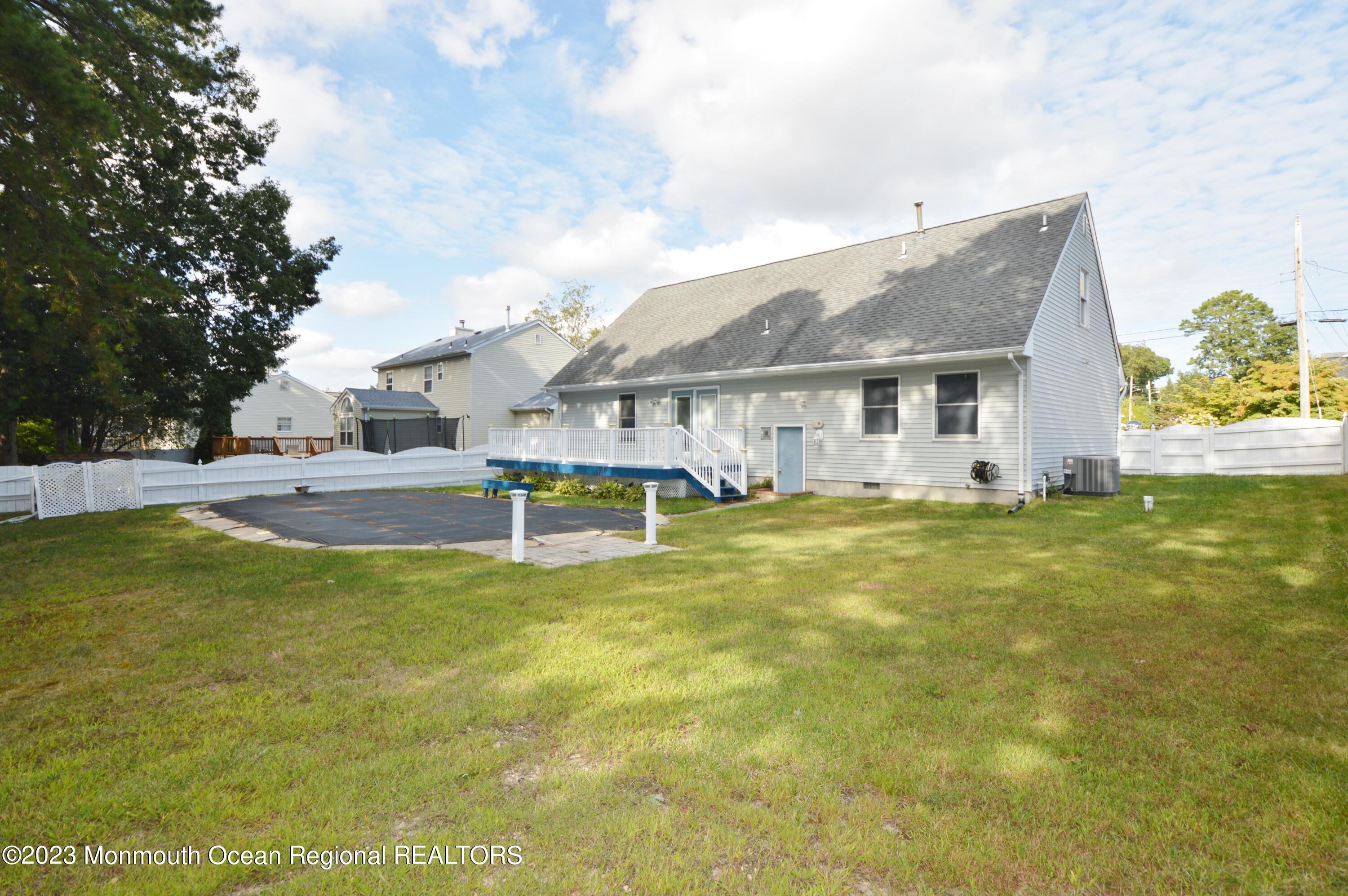 271 Sextant Road Manahawkin, NJ 08050 - Photo 46 of 48 a view of a house with a swimming pool