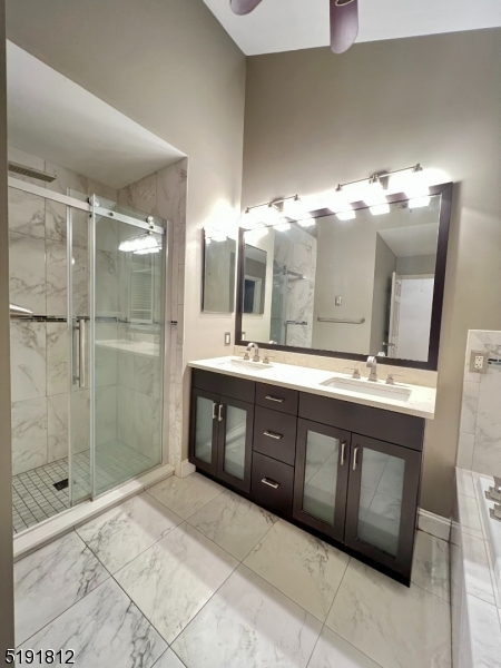 22 Constitution Way Bernards, NJ 07920 - Photo 11 of 19 a bathroom with a double vanity sink mirror and shower