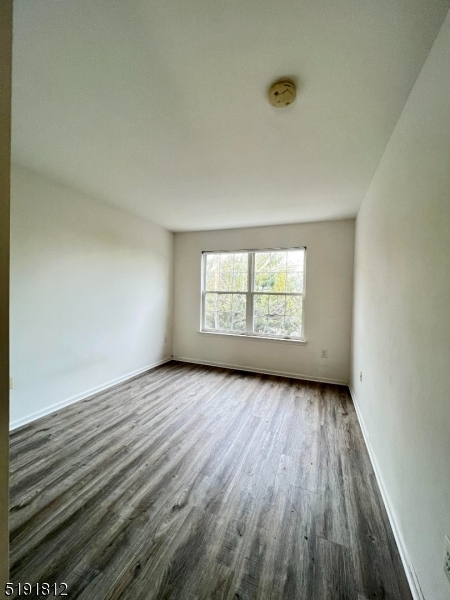 22 Constitution Way Bernards, NJ 07920 - Photo 13 of 19 an empty room with wooden floor and windows