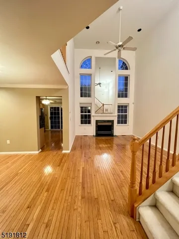 a view of a living room with wooden floor