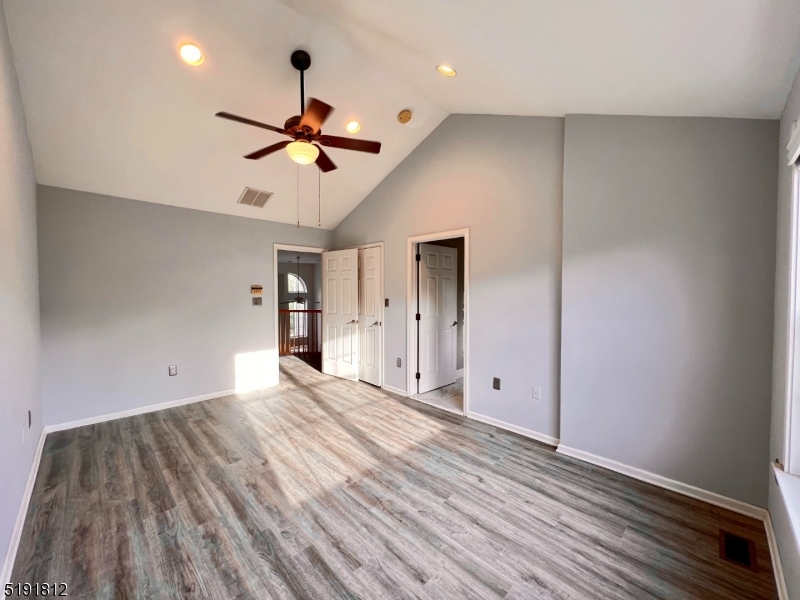 22 Constitution Way Bernards, NJ 07920 - Photo 9 of 19 a view of empty room with wooden floor and fan