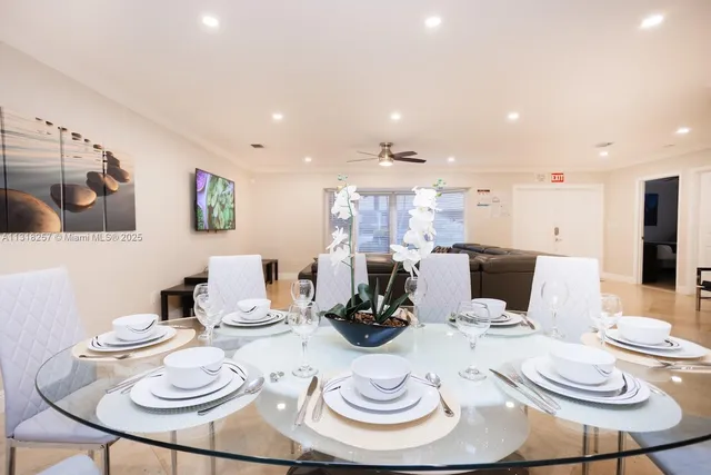 a bedroom with furniture and a flat screen tv