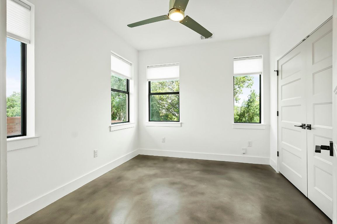 1104 Marcy Street, Unit B Austin, TX 78745 - Photo 23 of 38 an empty room with windows