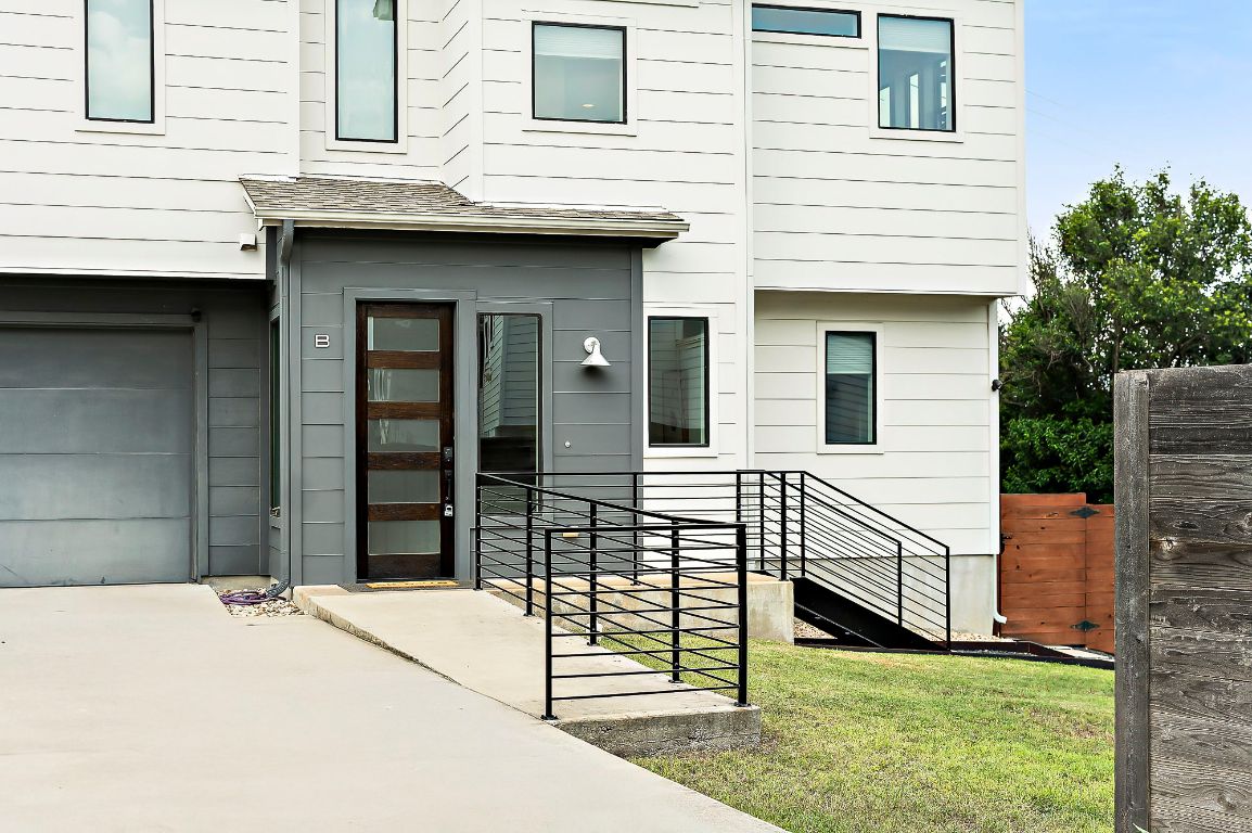 1104 Marcy Street, Unit B Austin, TX 78745 - Photo 5 of 38 a front view of a house with garage