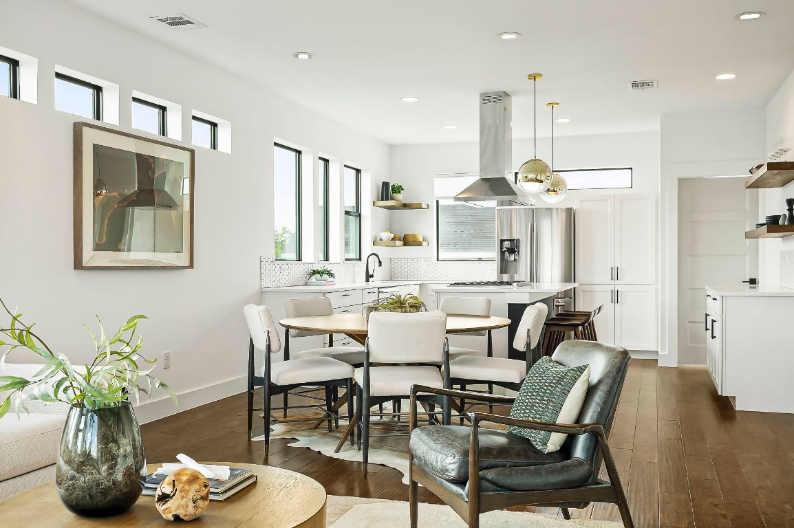 1104 Marcy Street, Unit B Austin, TX 78745 - Photo 10 of 38 a dining room with furniture a chandelier and kitchen view