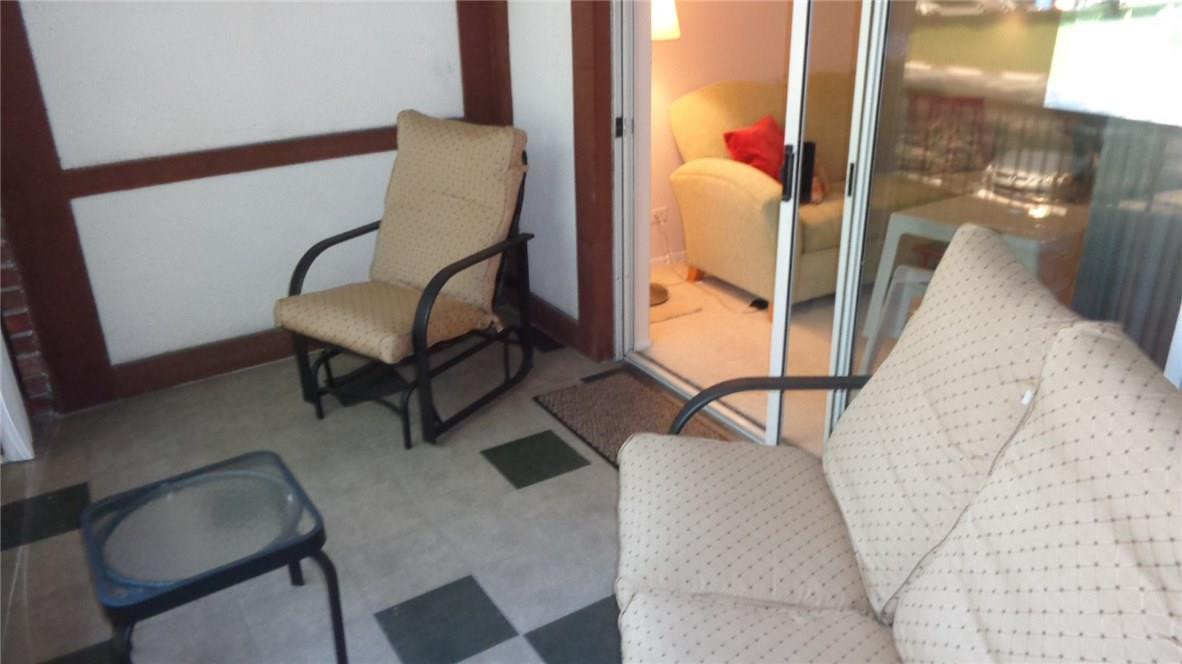 3670 Inverrary Drive, Unit 2C Lauderhill, FL 33319 - Photo 11 of 21 a balcony with table and chairs