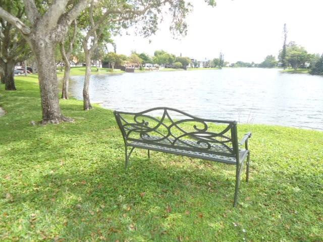 3670 Inverrary Drive, Unit 2C Lauderhill, FL 33319 - Photo 13 of 21 a view of lake from a yard