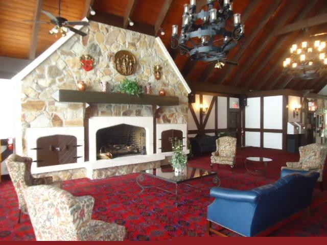 3670 Inverrary Drive, Unit 2C Lauderhill, FL 33319 - Photo 14 of 21 a living room with fireplace furniture and a fireplace