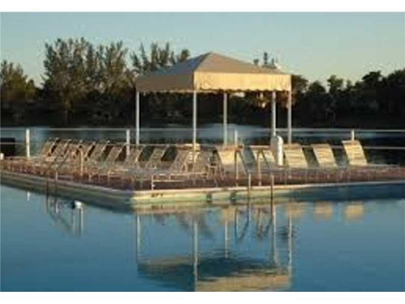 3670 Inverrary Drive, Unit 2C Lauderhill, FL 33319 - Photo 21 of 21 a view of a lake with a house