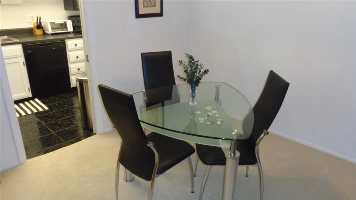 3670 Inverrary Drive, Unit 2C Lauderhill, FL 33319 - Photo 6 of 21 a dining room with furniture and wooden floor
