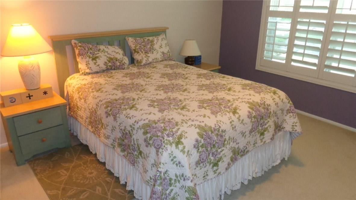 3670 Inverrary Drive, Unit 2C Lauderhill, FL 33319 - Photo 8 of 21 a large bed sitting in a bedroom next to a window