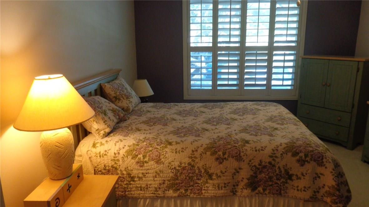 3670 Inverrary Drive, Unit 2C Lauderhill, FL 33319 - Photo 10 of 21 a bed sitting in a bedroom next to a window