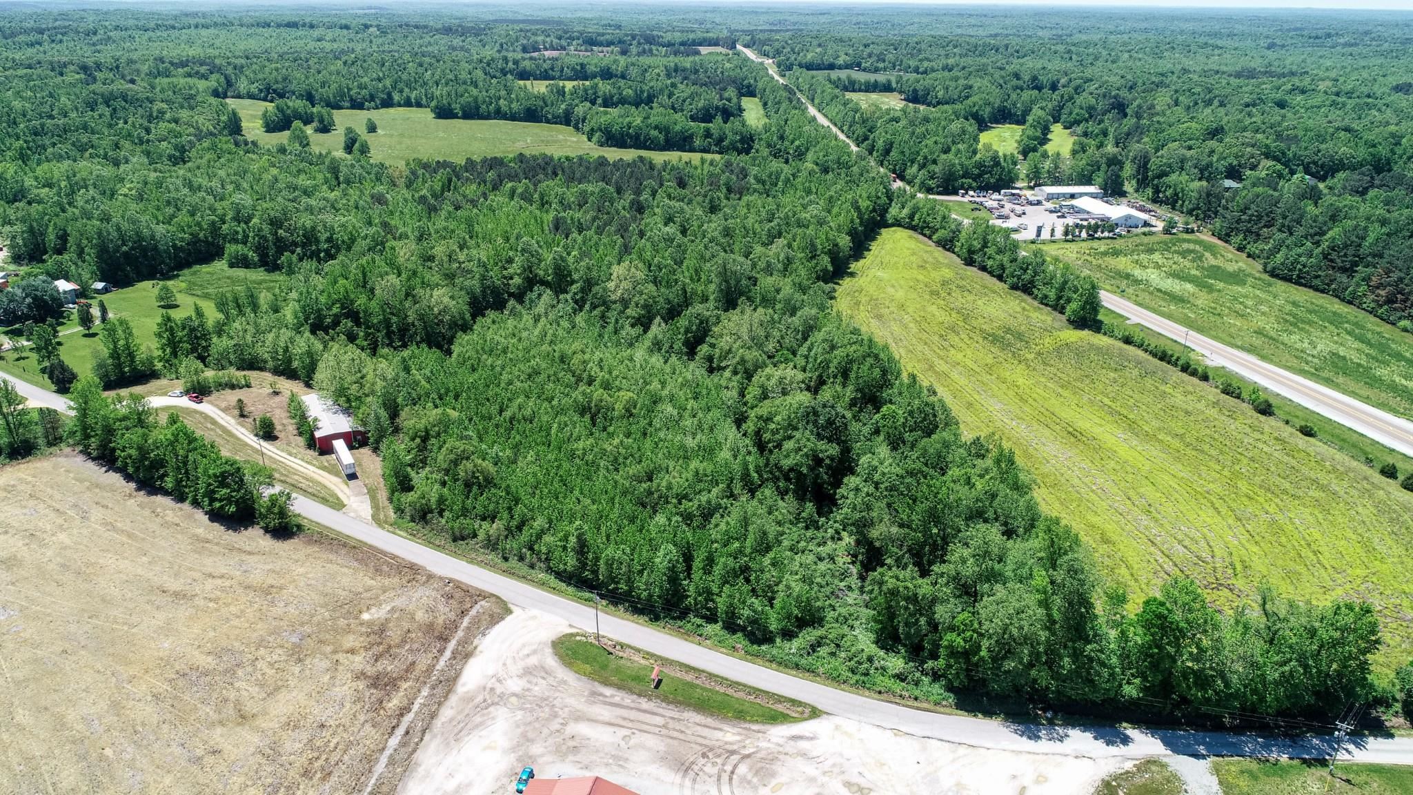 198 McIllwain Road Holladay, TN 38341 - Photo 25 of 28 an aerial view of residential houses with outdoor space and trees