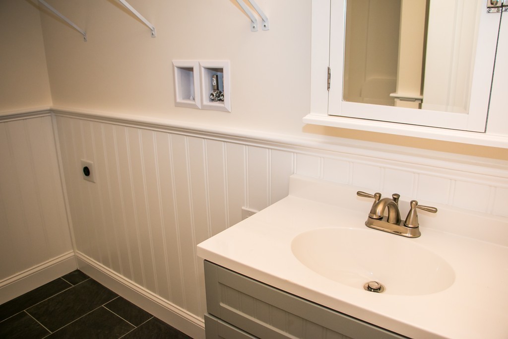 6 Walnut Road Chelmsford, MA 01824 - Photo 11 of 23 a bathroom with a sink and vanity