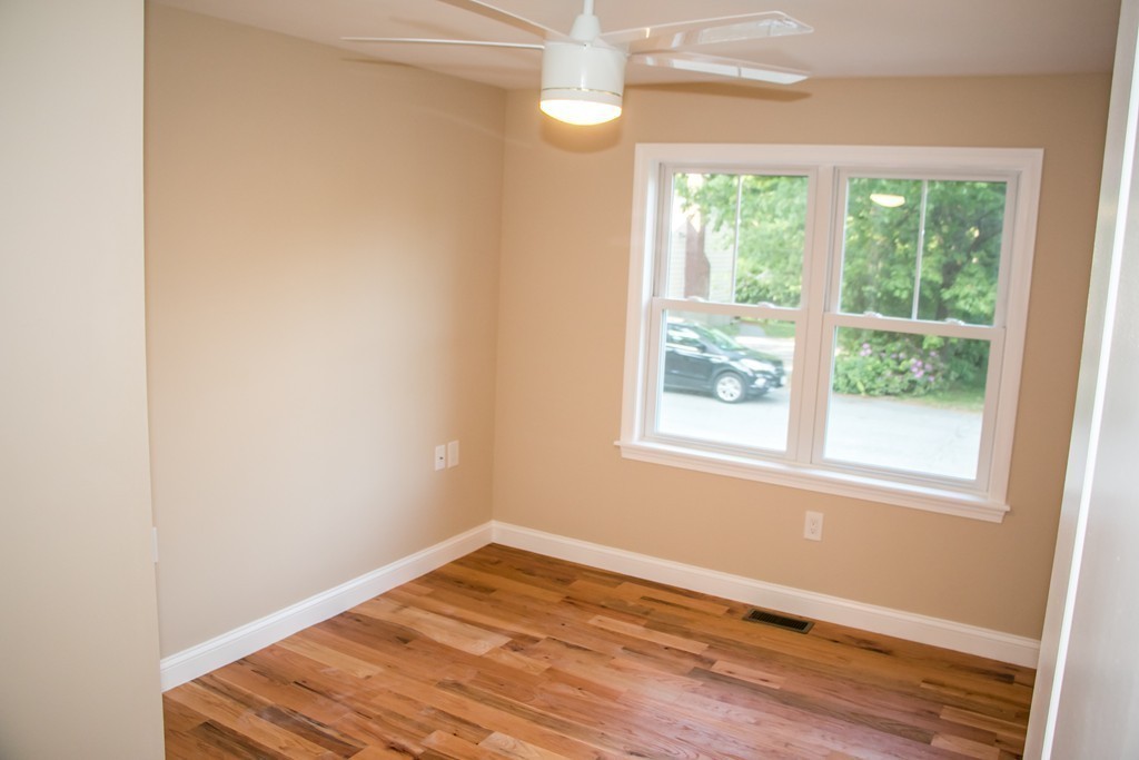 6 Walnut Road Chelmsford, MA 01824 - Photo 14 of 23 an empty room with wooden floor and windows