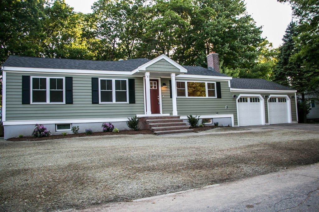 6 Walnut Road Chelmsford, MA 01824 - Photo 2 of 23 a front view of a house with a yard