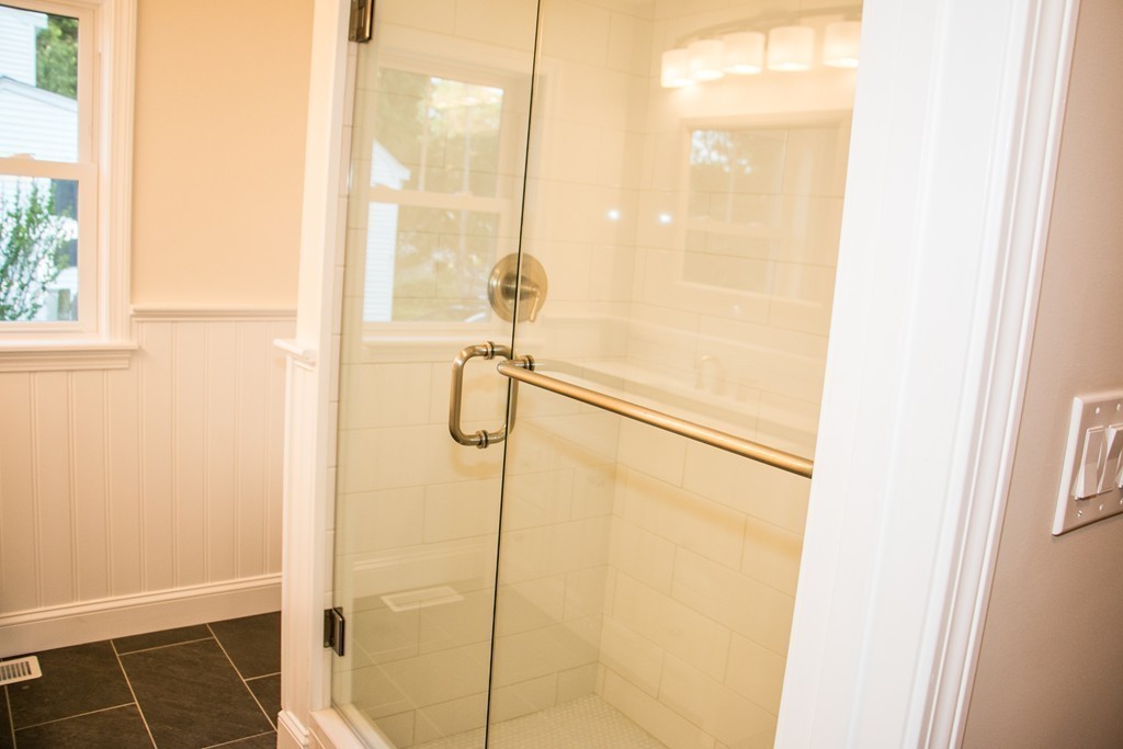 6 Walnut Road Chelmsford, MA 01824 - Photo 21 of 23 a bathroom with a glass shower door