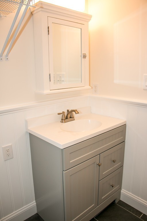 6 Walnut Road Chelmsford, MA 01824 - Photo 10 of 23 a bathroom with a sink and a mirror