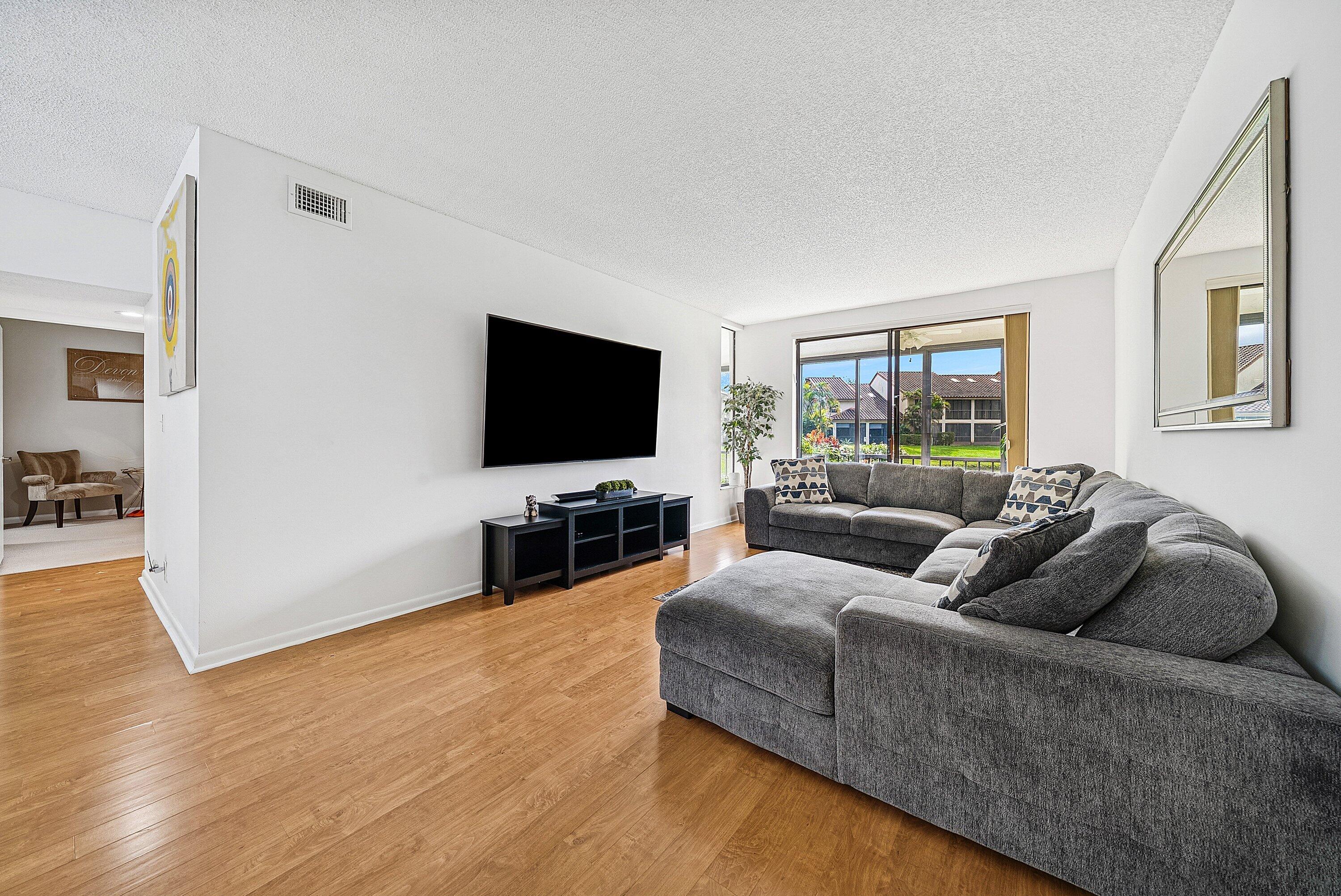 7933 La Mirada Drive Boca Raton, FL 33433 - Photo 17 of 33 a living room with furniture and a flat screen tv