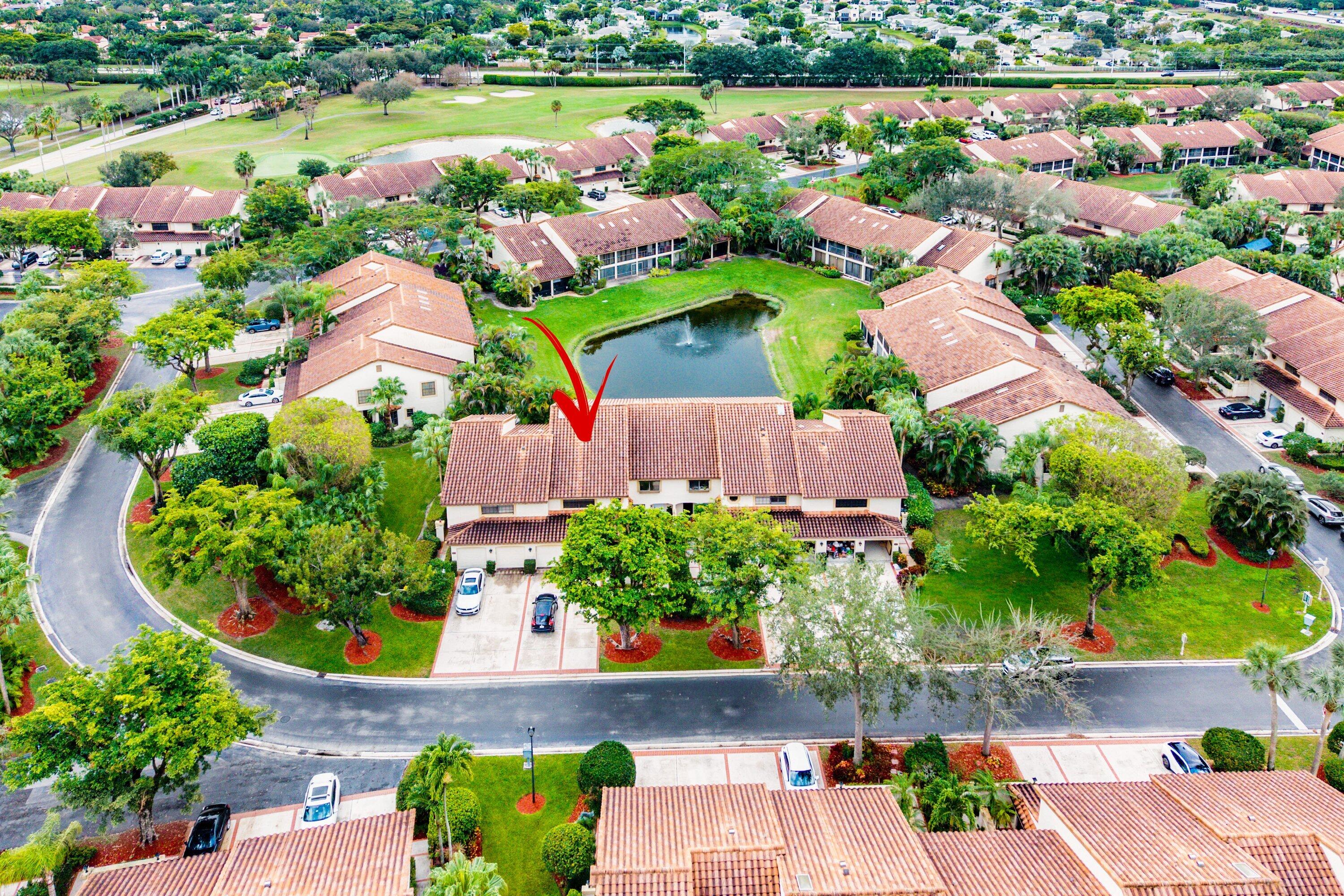 7933 La Mirada Drive Boca Raton, FL 33433 - Photo 2 of 33 an aerial view of a house with a garden and lake view