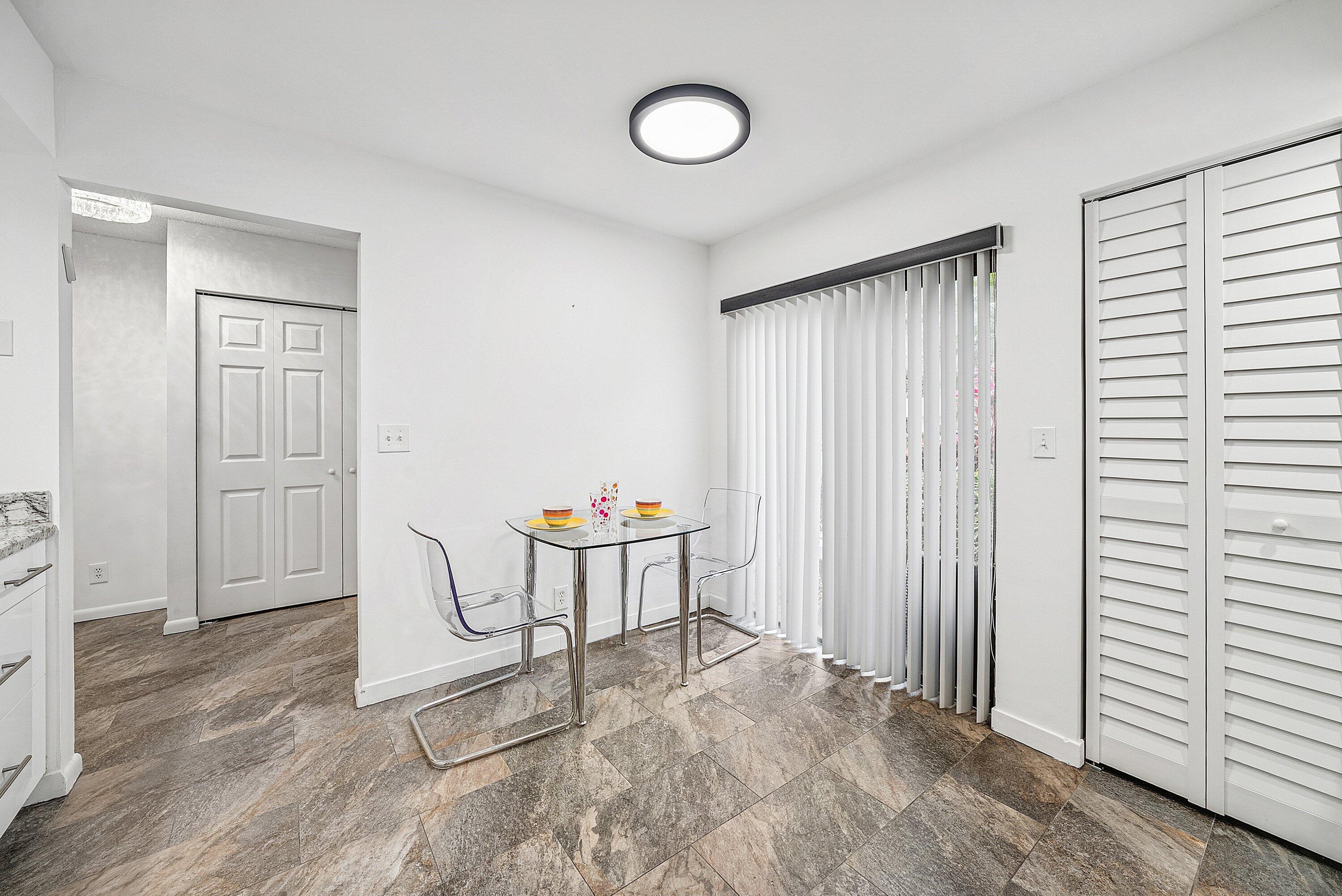 7933 La Mirada Drive Boca Raton, FL 33433 - Photo 8 of 33 a view of a room with chairs and wooden floor