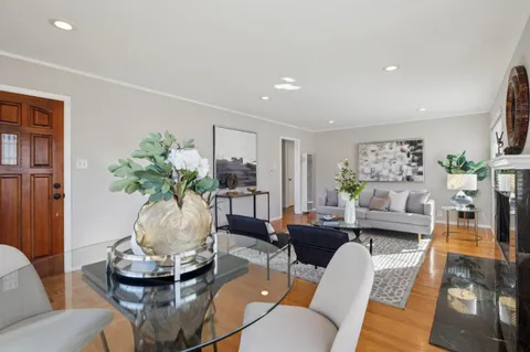 a living room with furniture and a table