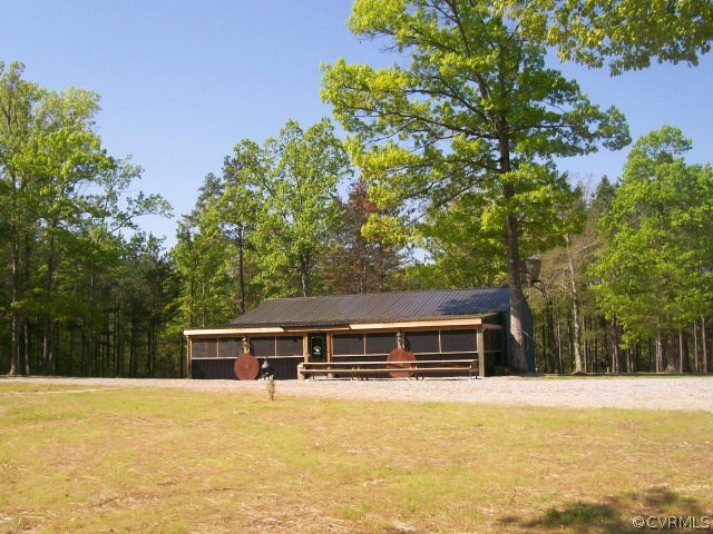 3505 Falls Road Victoria, VA 23974 - Photo 11 of 14 a front view of house with yard and trees in the background