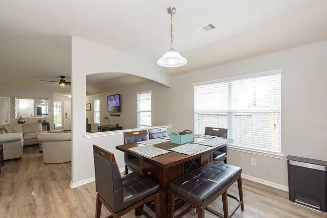 a view of a dining room with furniture window and wooden floor