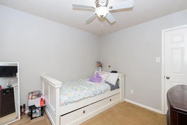 a bedroom with a bed and a tv in it