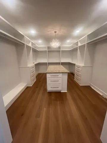 a living room with hard wood floors and a window