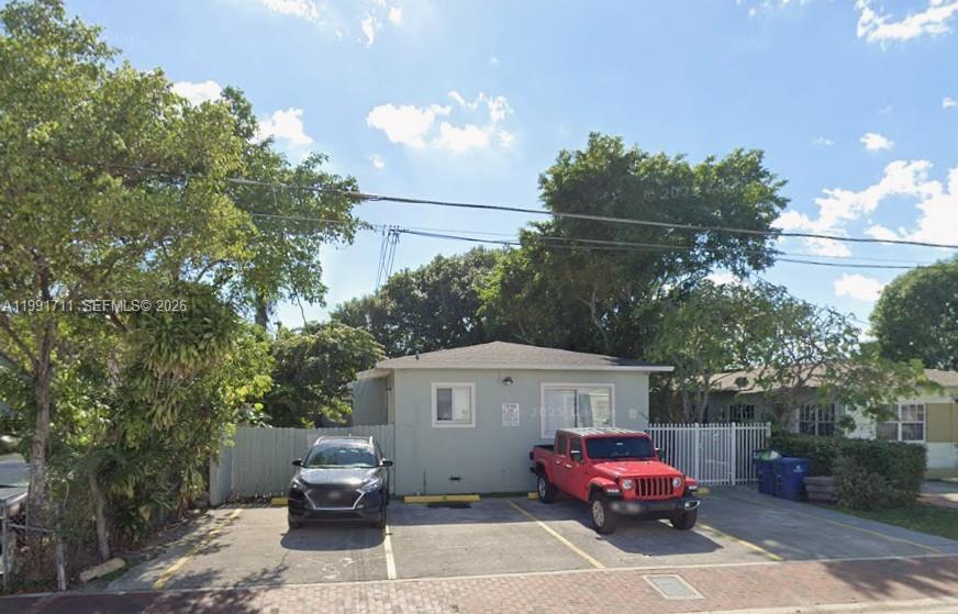 1514 Southwest 6th Street, Unit 4 Miami, FL 33135 - Photo 1 of 6 a front view of a house with a garden