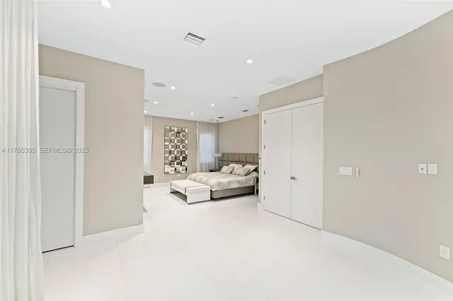 a living room with furniture white walls and white walls