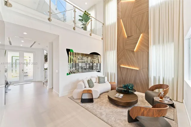 a bedroom with furniture and a large window