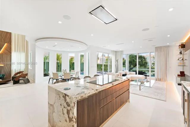 a large white kitchen with a large window