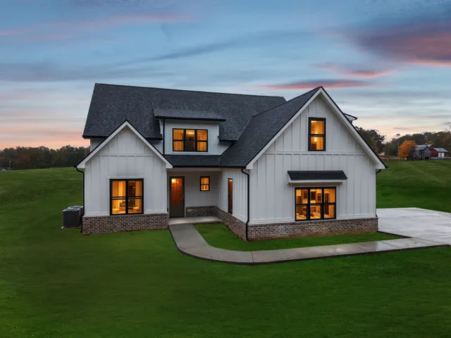 a view of house with backyard