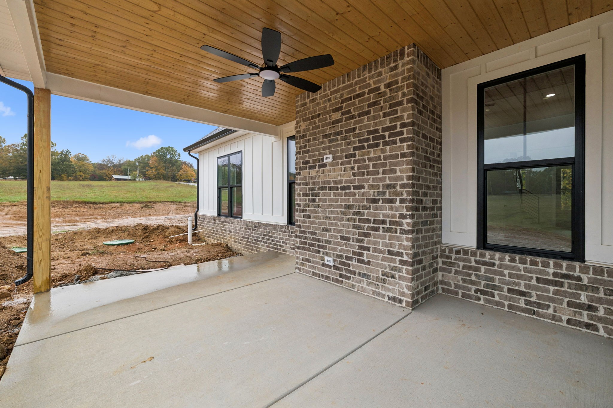 3151 Sulphur Springs Road Clarksville, TN 37043 - Photo 78 of 94 a view of a porch with a floor to ceiling window next to a yard